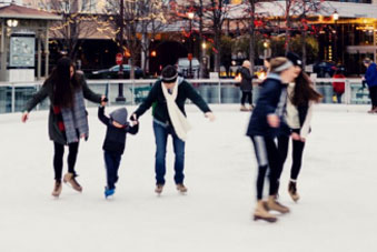 A group of people ice skating.