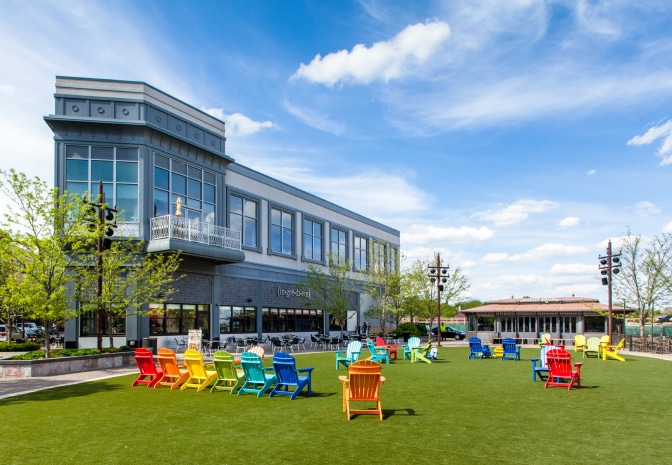A park outside the garden with colorful chairs.