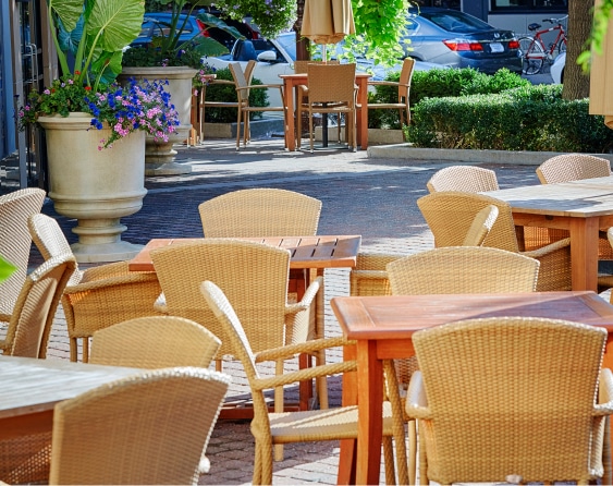 Tables and chairs outside of the establishment.